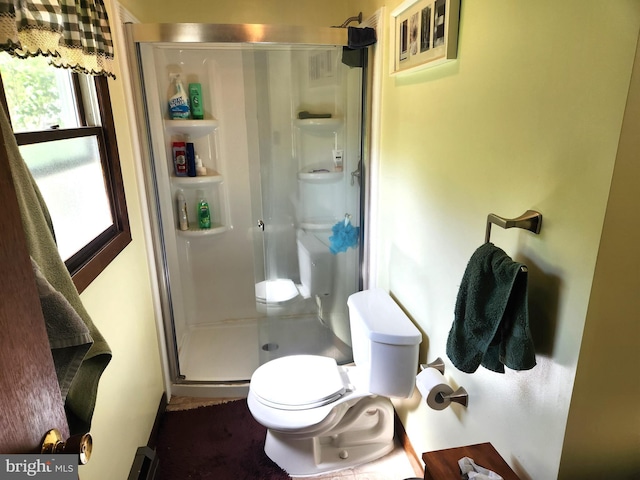 full bathroom with toilet and a shower stall