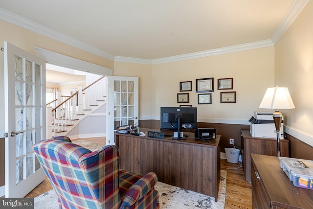 office featuring french doors, crown molding, and wood finished floors