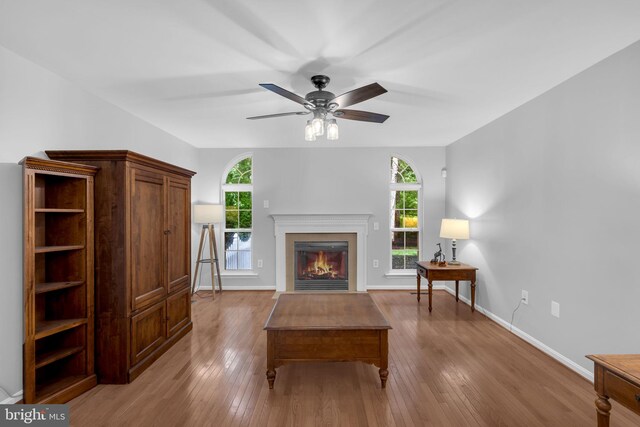 5620 Nutwell Sudley Rd, Deale, MD 20751 - living room featuring wood-type flooring, baseboards, plenty of natural light, and a ceiling fan