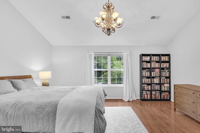 5620 Nutwell Sudley Rd, Deale, MD 20751 - bedroom with wood finished floors, a chandelier, and baseboards