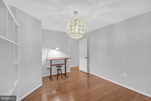 5620 Nutwell Sudley Rd, Deale, MD 20751 - unfurnished room with a chandelier, wood finished floors, and baseboards