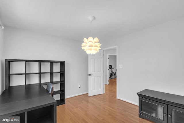 5620 Nutwell Sudley Rd, Deale, MD 20751 - unfurnished office featuring light wood finished floors, baseboards, and a chandelier