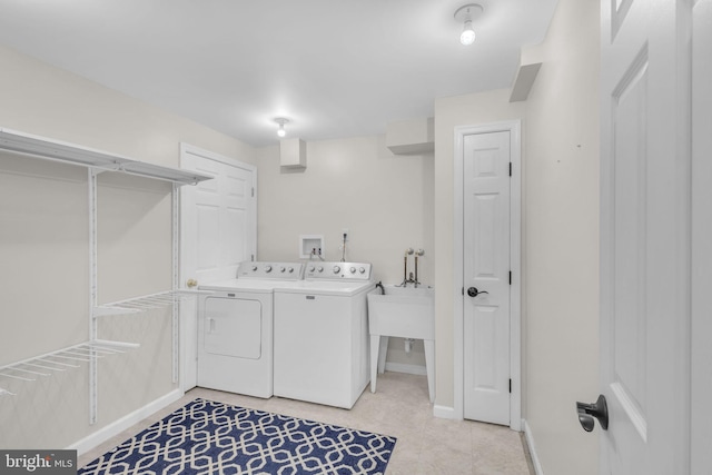5620 Nutwell Sudley Rd, Deale, MD 20751 - laundry room featuring separate washer and dryer, baseboards, and light tile patterned floors