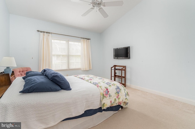 bedroom with carpet floors, lofted ceiling, baseboards, and ceiling fan
