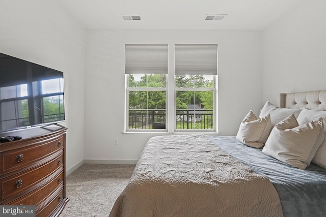 10755 Fairgrounds Dr Unit 320, Fairfax, VA 22030 - carpeted bedroom featuring multiple windows and baseboards