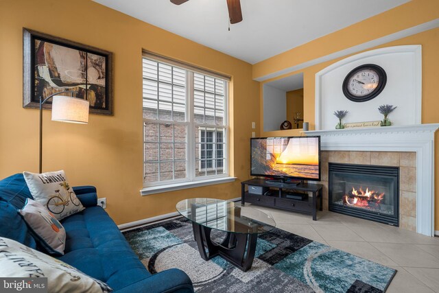 42496 Legacy Park Dr, Brambleton, VA 20148 - tiled living room featuring a ceiling fan, a tile fireplace, and baseboards