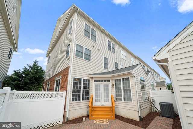42496 Legacy Park Dr, Brambleton, VA 20148 - back of house with central AC, entry steps, and fence