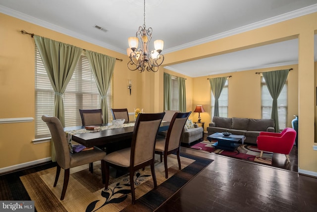 42496 Legacy Park Dr, Brambleton, VA 20148 - dining room with ornamental molding, hardwood / wood-style floors, a chandelier, and baseboards