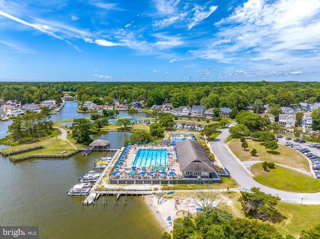 10 Riverside Ct, Ocean Pines, MD 21811 - drone / aerial view of a nearby body of water, a pool area, and a heavily wooded area