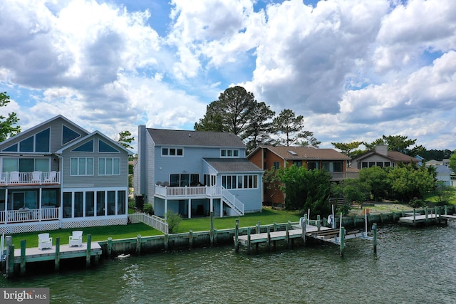 10 Riverside Ct, Ocean Pines, MD 21811 - back of property with a sunroom, stairs, a lawn, and a deck with water view