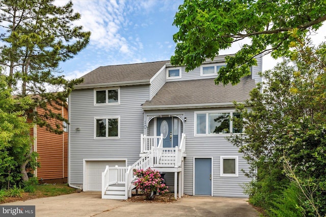 10 Riverside Ct, Ocean Pines, MD 21811 - view of front of home featuring a shingled roof, driveway, stairs, and a garage