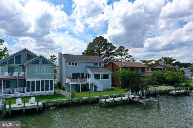 10 Riverside Ct, Ocean Pines, MD 21811 - back of property with a sunroom, stairs, a lawn, and a deck with water view