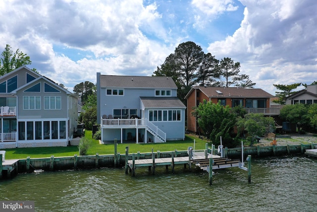 10 Riverside Ct, Ocean Pines, MD 21811 - back of house featuring stairway, a sunroom, a deck with water view, and a yard
