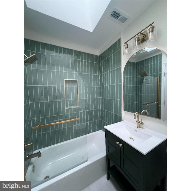 bathroom featuring vanity,  shower combination, and visible vents