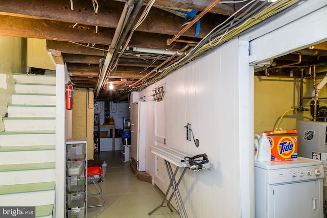 unfinished below grade area with washer / dryer, water heater, and stairway