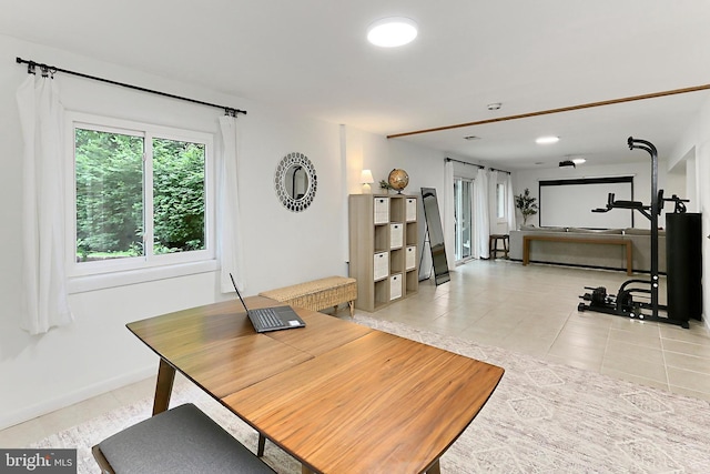 office area with light tile patterned flooring and baseboards