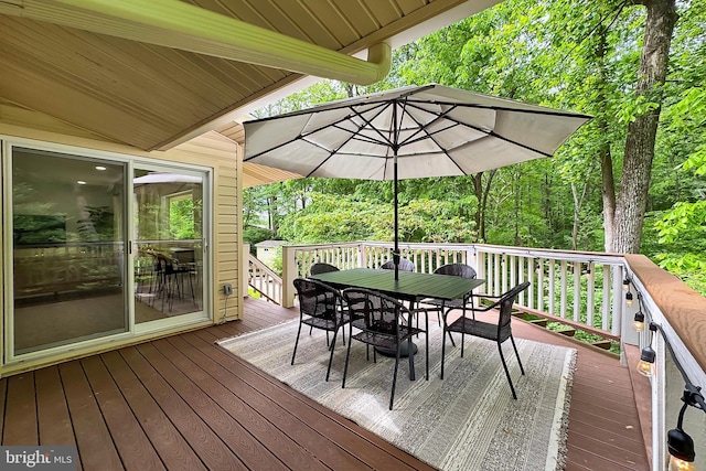 wooden deck with outdoor dining area