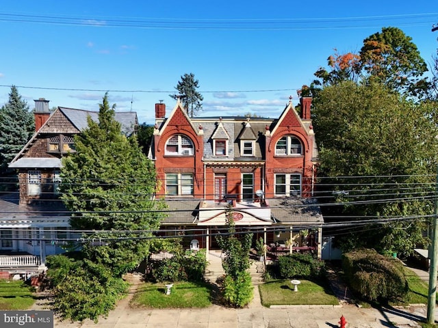 911 E King St, Lancaster, PA 17602 - view of front of home with a chimney and brick siding