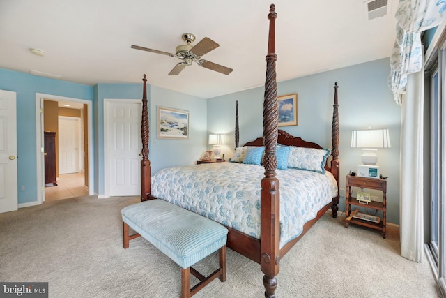 carpeted bedroom with baseboards and a ceiling fan