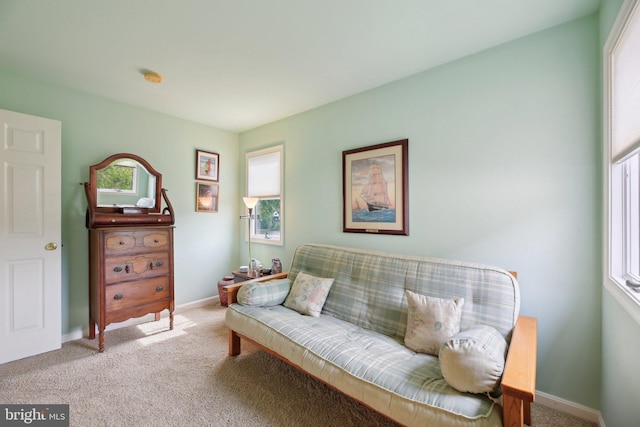sitting room with carpet floors and baseboards