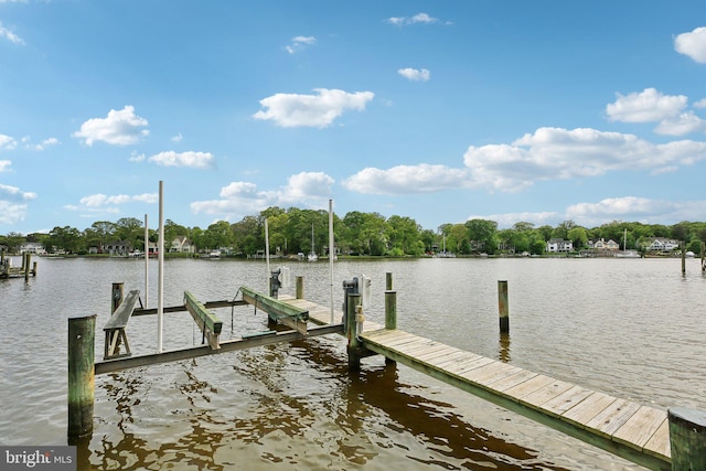 dock with a water view and boat lift
