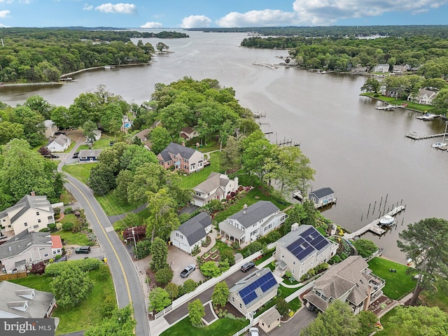 aerial view of residential area featuring a nearby body of water