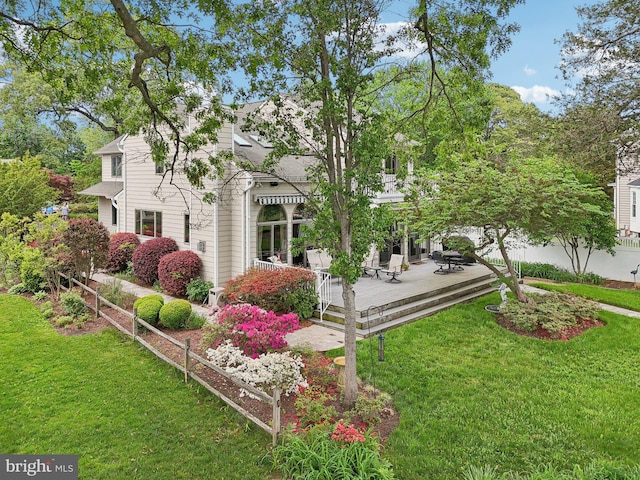 view of home's exterior with a lawn and a wooden deck