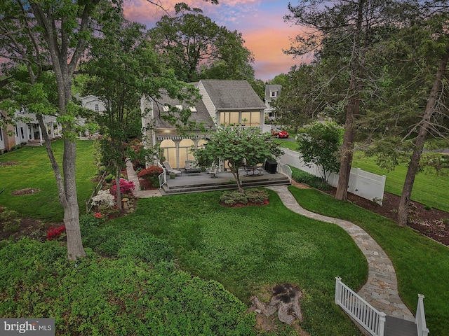 view of yard at dusk