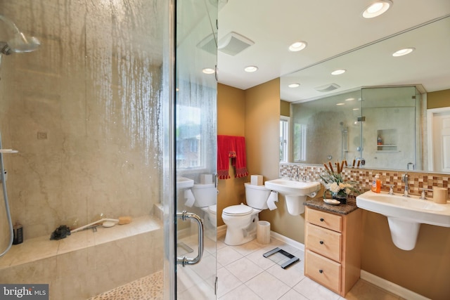 full bathroom with a shower stall, tile patterned flooring, decorative backsplash, toilet, and recessed lighting