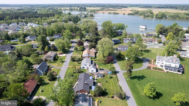 bird's eye view featuring a water view and a residential view