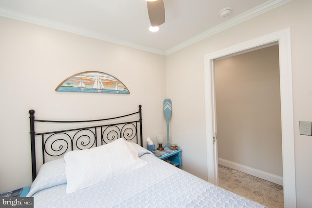 bedroom featuring baseboards, ornamental molding, carpet flooring, and a ceiling fan