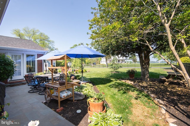 view of yard with a patio area and fence