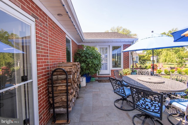 view of patio featuring outdoor dining area