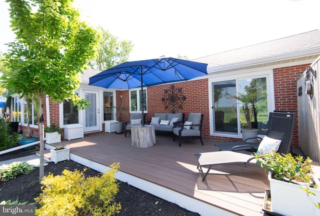 wooden terrace with outdoor lounge area