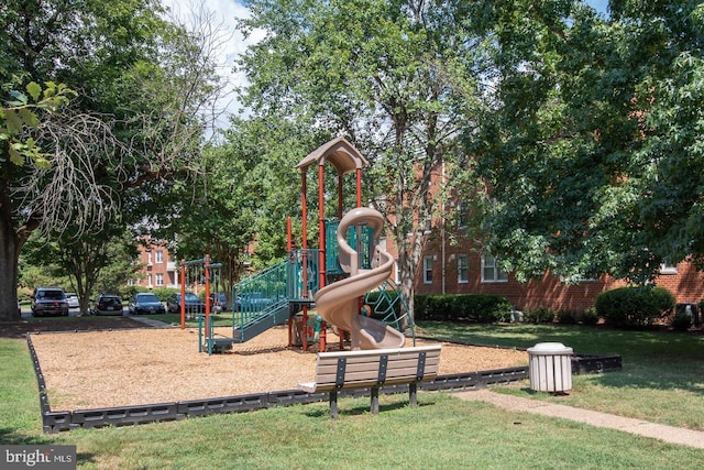 communal playground featuring a lawn