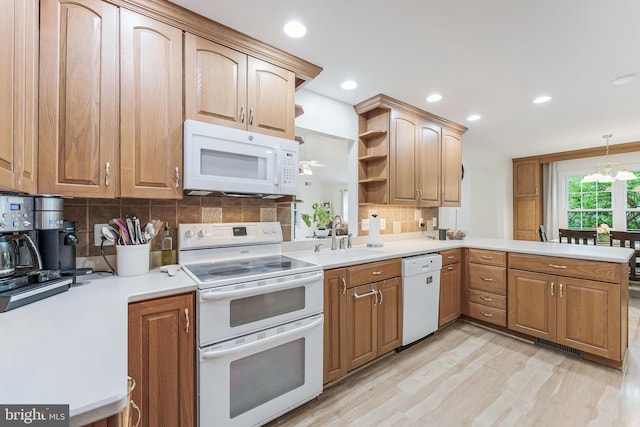 kitchen featuring a sink, open shelves, white appliances, backsplash, and light countertops