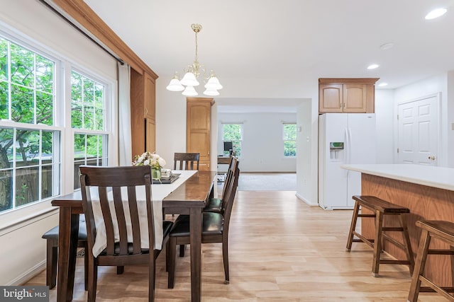 dining room featuring a chandelier, recessed lighting, baseboards, and light wood-style floors