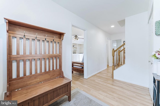 interior space featuring stairs, wood finished floors, baseboards, and recessed lighting