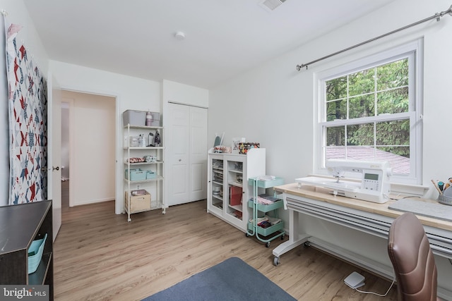 office space featuring light wood-style floors