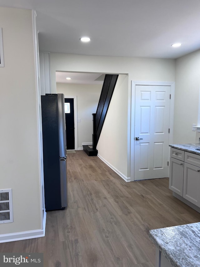 711 Tuckahoe Rd, Vineland, NJ 08360 - kitchen with freestanding refrigerator, baseboards, visible vents, and wood finished floors