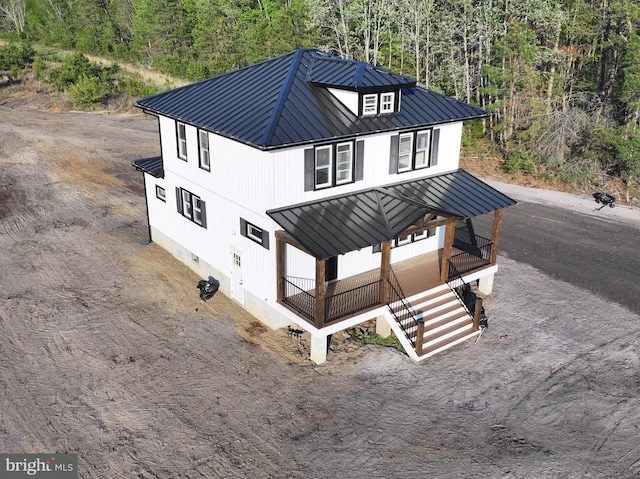 711 Tuckahoe Rd, Vineland, NJ 08360 - exterior space featuring a wooded view, stairway, and metal roof