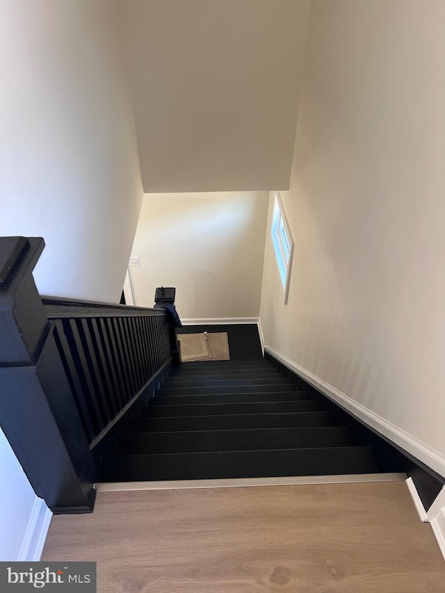 711 Tuckahoe Rd, Vineland, NJ 08360 - stairway with wood finished floors and baseboards
