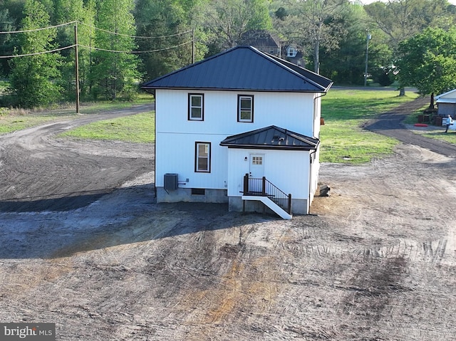 711 Tuckahoe Rd, Vineland, NJ 08360 - back of property featuring cooling unit and metal roof