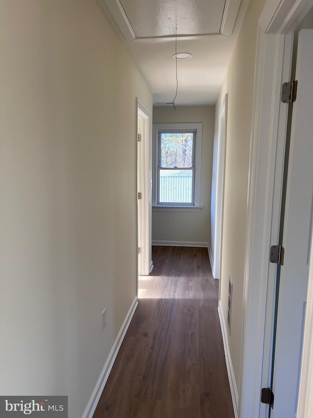 711 Tuckahoe Rd, Vineland, NJ 08360 - hallway featuring baseboards, dark wood finished floors, attic access, and visible vents