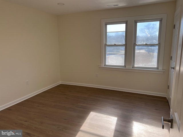 711 Tuckahoe Rd, Vineland, NJ 08360 - spare room featuring visible vents, wood finished floors, and baseboards