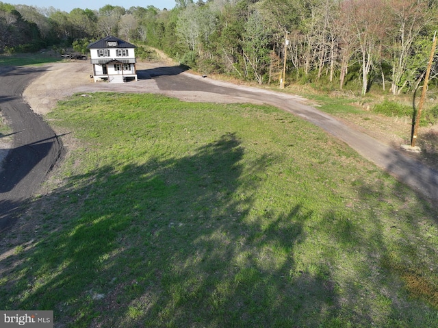 711 Tuckahoe Rd, Vineland, NJ 08360 - view of street featuring driveway and a view of trees