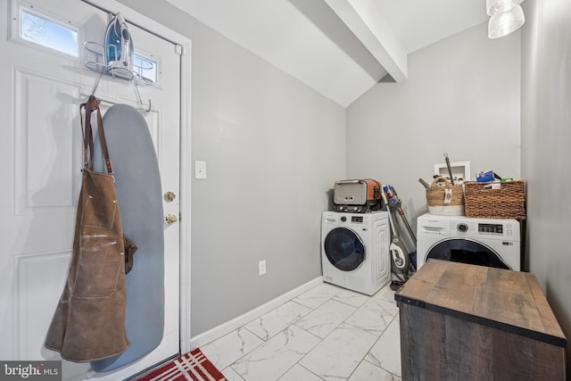 clothes washing area featuring baseboards, marble finish floor, laundry area, and washer and dryer