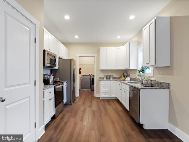 kitchen with appliances with stainless steel finishes, stone counters, dark wood-style flooring, baseboards, and recessed lighting