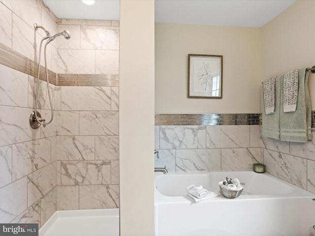 bathroom with a stall shower and a garden tub
