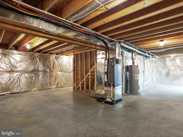 unfinished below grade area with water heater, heating unit, and stairs